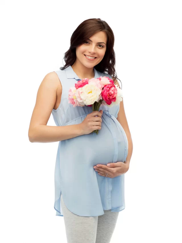 pregnancy-motherhood-holidays-people-expectation-concept-happy-pregnant-woman-with-flowers-touching-her-big-belly-white-background
